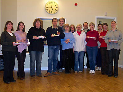 The hago team eating birthday cake